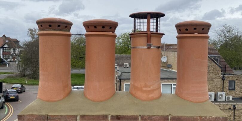 chimneys image on brick roof image